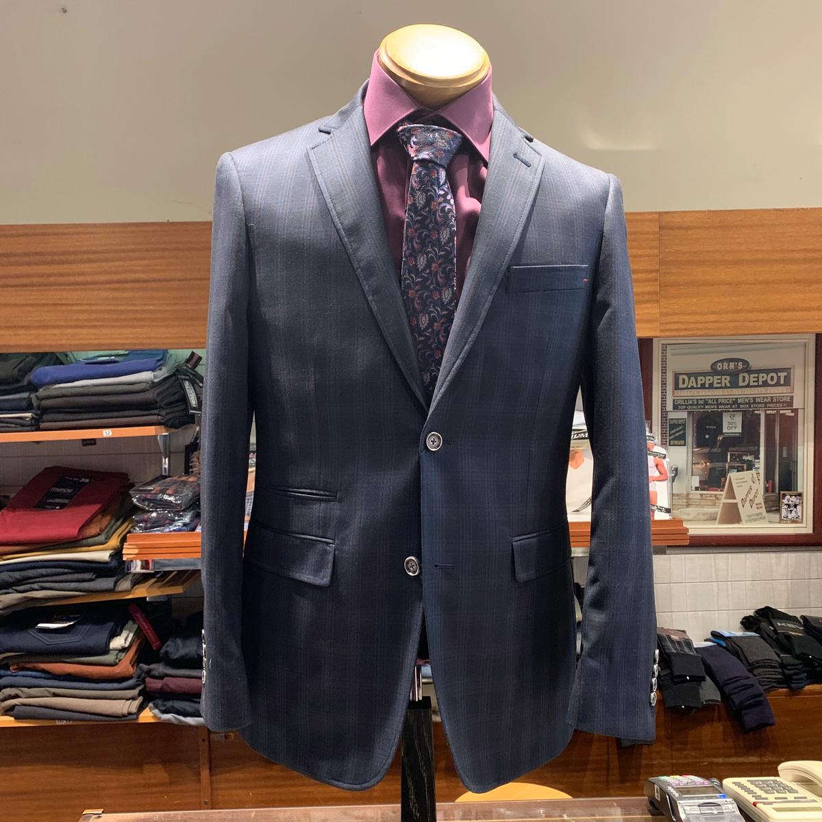 Navy suit with pink dress shirt on display at Dapper Depot Menswear Orillia